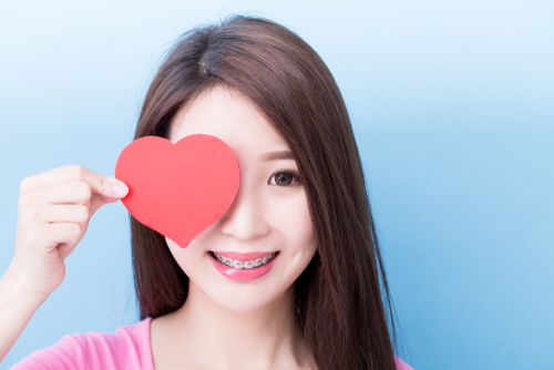 Woman,Wear,Brace,And,Take,Heart,On,The,Blue,Background