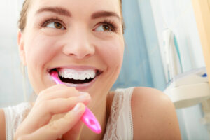 Young,Woman,Brushing,Cleaning,Teeth.,Girl,With,Toothbrush,In,Bathroom.